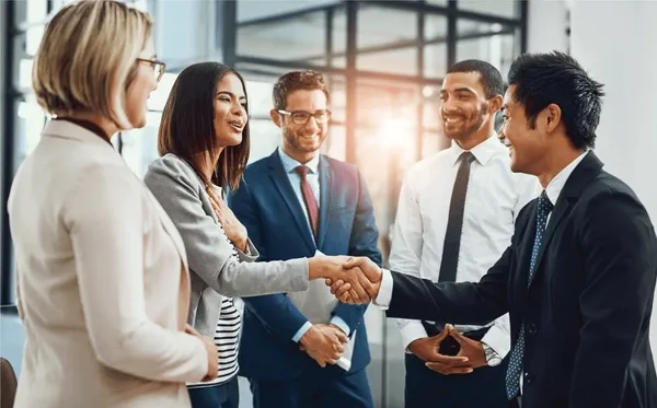 a man make a handshake to one of the team member